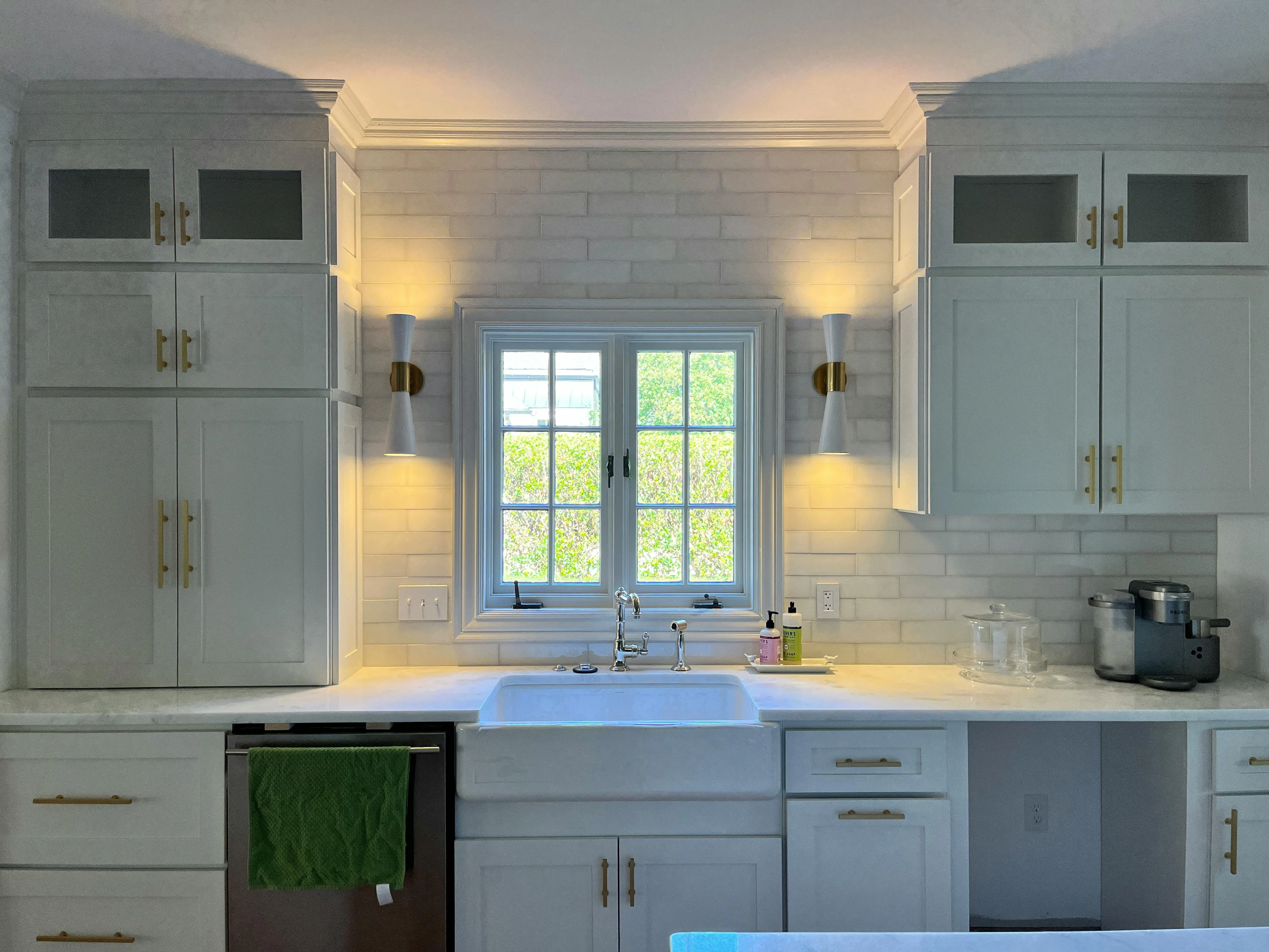 Selling Your Edmonton Home With A Kitchen Refresh white cupboards, farmers sink, bright kitchen